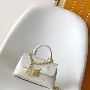 p560M27698 Green M12145 Off-White M12144 Black M12211 Blue M27043 Pink This Nano Madeleine handbag reimagines the Madeleine in Monogram Empreinte leather, featuring a classic S-lock closure and a detachable chain adorned with the LV Circle emblem.Ample space accommodates daily essentials, suitable for hand-carrying, shoulder-carrying, or crossbody wear.12.5 x 6 x 21 cm (H x W x L) Soft grained calf leather Calf leather trim Fabric lining Metal hardware Patch pocket with card slots Accordion compartment S-lock clasp Chain: Z06 Chain length: 56.0 cm Handles: Single handle Made in France, Spain, Italy, or the USA